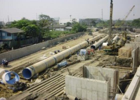 View form top floor of Pump Building showing laying of discharge pipes. RC structures are valve chambers.