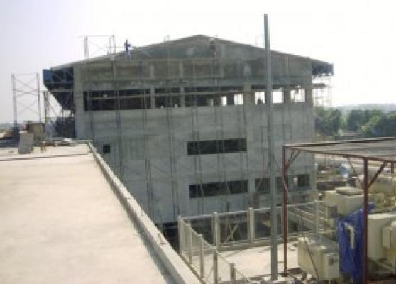 View from Reservoir roof showing Pumping Station Wall plastering work in progress. Part of Sub Station visible in the foreground.